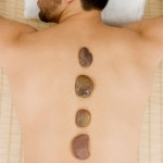 man receiving hot stone massage